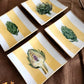 Conjunto 4 mini platos de pan diseño rayas y alcachofas 10cm